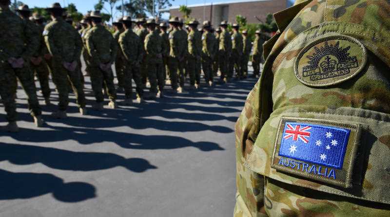 Australian Defence Force (ADF) personnel are seen in uniform on parade