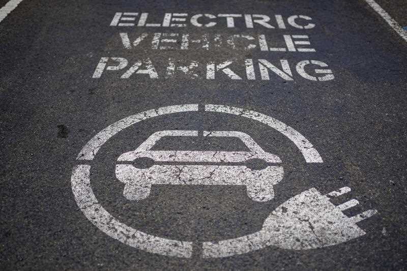 A sign for an electric vehicle charging space
