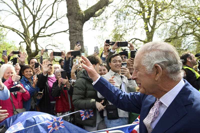 King Charles III greets well-wishers outside Buckingham Palace, in London, Friday, May 5, 2023 a day before his coronation takes place at Westminster Abbey