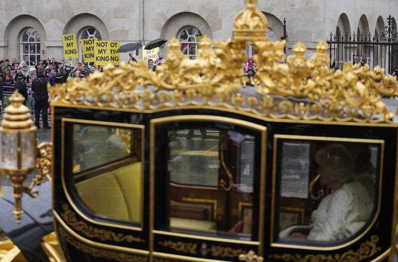 Members of the anti-monarchist group Republic stage a protest as Britain's King Charles III and Camilla, the Queen Consort, travel in the Diamond Jubilee State Coach towards Westminster Abbey to their coronation ceremony, in London, Saturday, May 6