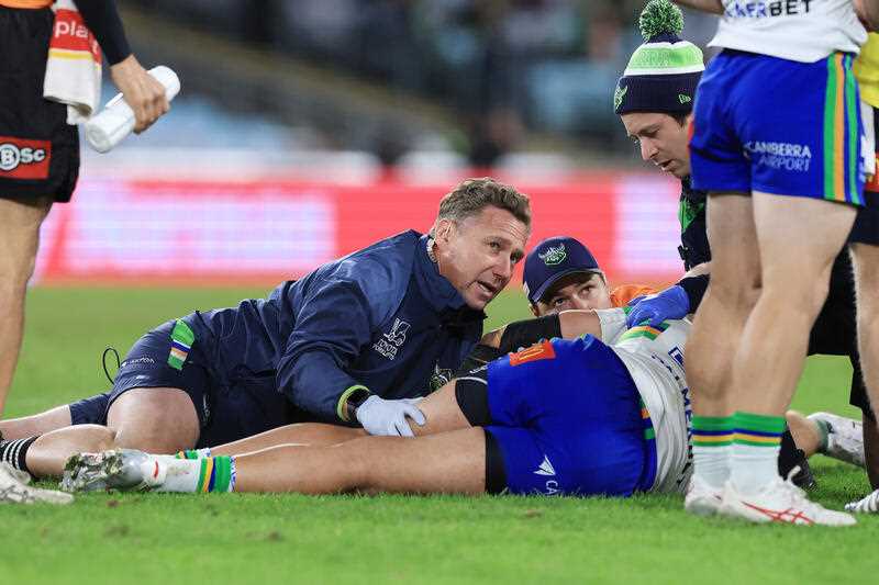 Medical staff attend to Corey Harawira-Naera of the Raiders during the NRL Round 13 match between the South Sydney Rabbitohs and the Canberra Raiders at ACCOR Stadium in Sydney, Saturday, May 27, 2023