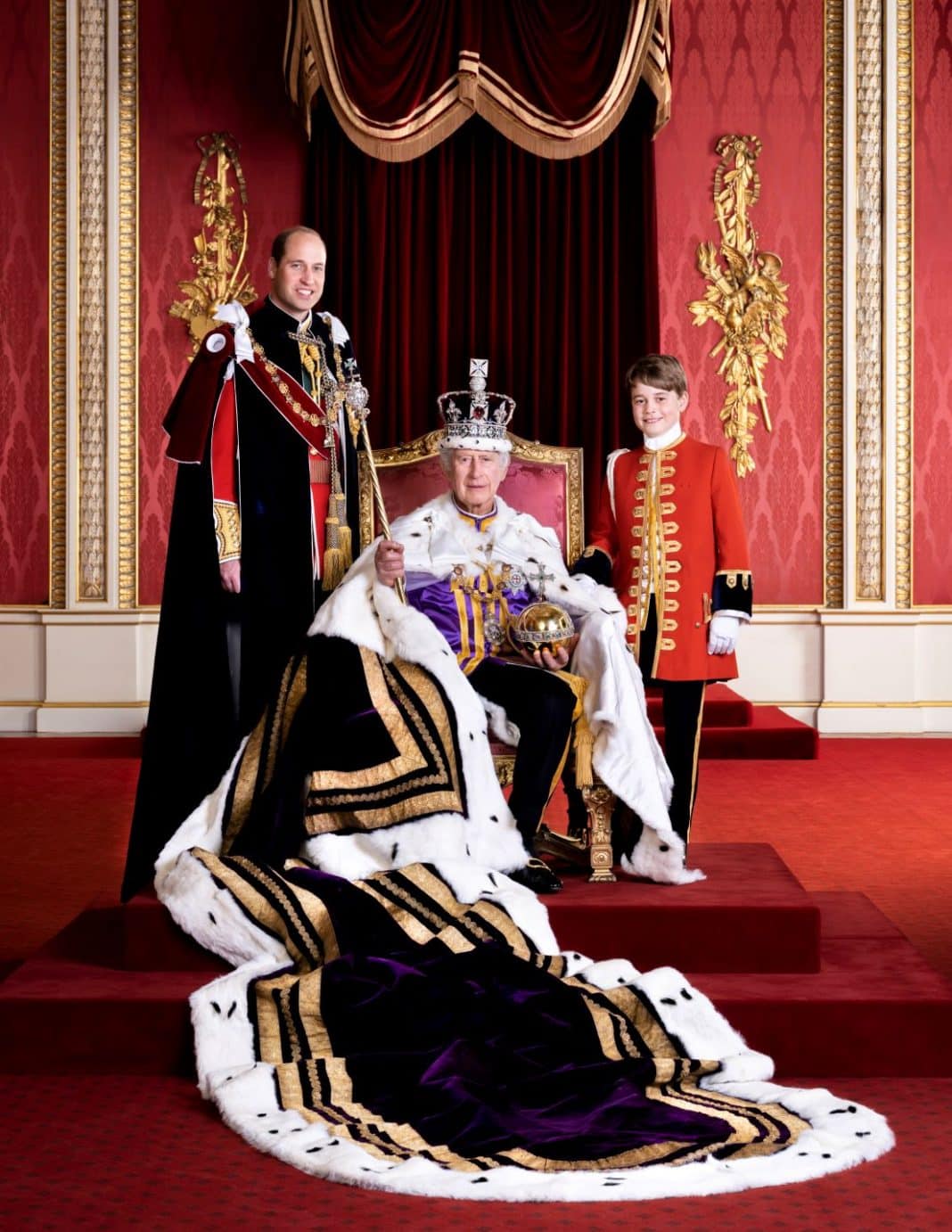 King Charles III, the Prince of Wales and Prince George pose for a photo, on the day of the coronation, Saturday, May 6, 2023, in the Throne Room at Buckingham Palace