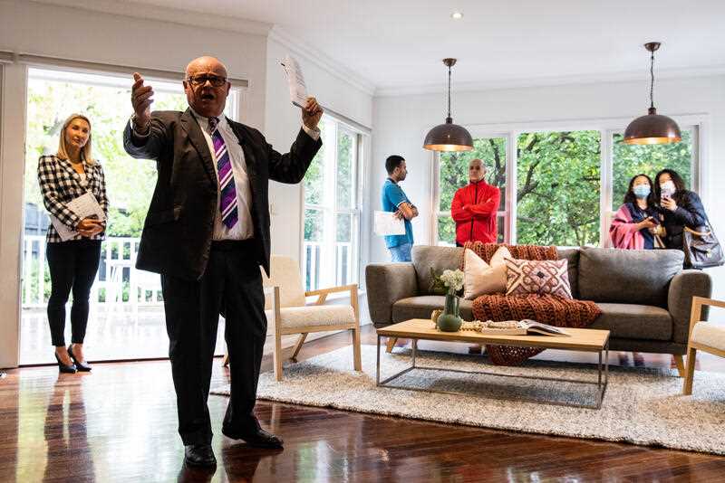 An auction director conducts an auction on a property in Melbourne