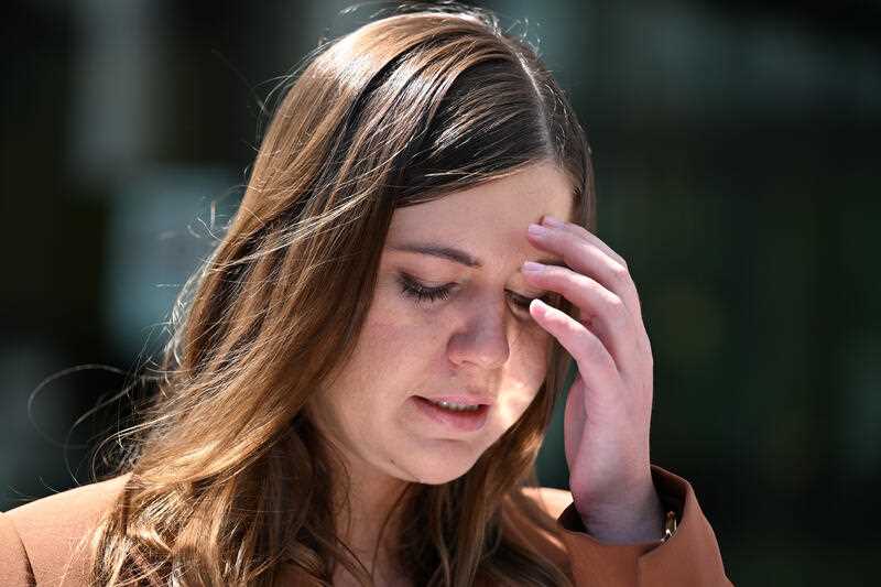 Former Liberal Party staffer Brittany Higgins makes a statement after leaving the ACT Supreme Court in Canberra, Thursday, October 27, 2022