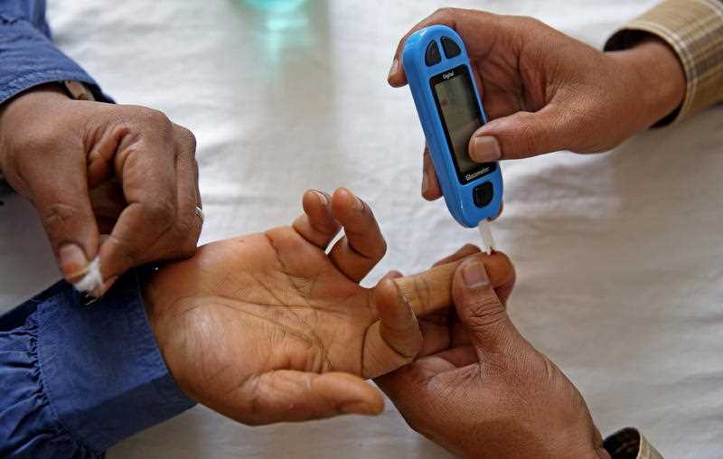A man undergoes Gluco meter random blood sugar test