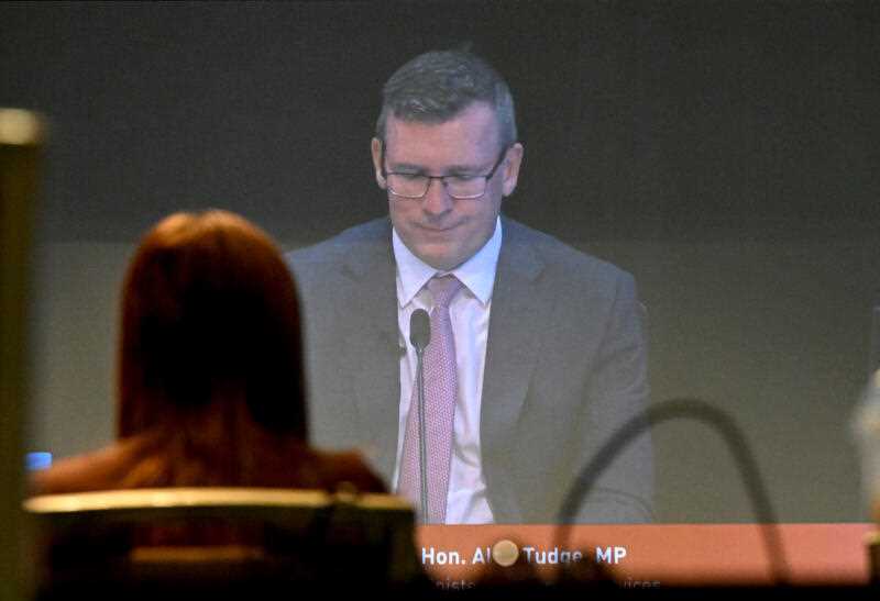 Former Liberal minister Alan Tudge is seen on a screen in the media room during the third block of public hearings of the Royal Commission into the Robodebt Scheme