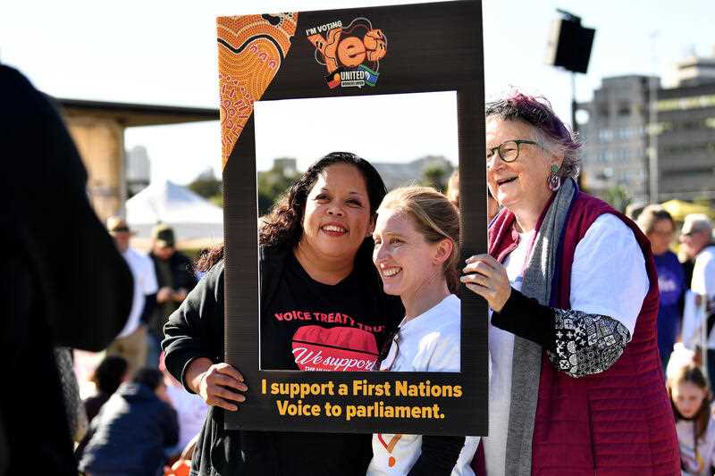 Supporters hold placards during a Yes 23 community event in support of an Indigenous Voice to Parliament, in Sydney, Sunday, July 2, 2023.