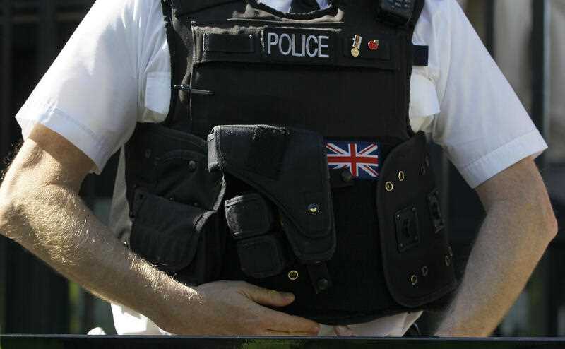 A London Metropolitan Police officer keeps watch in London