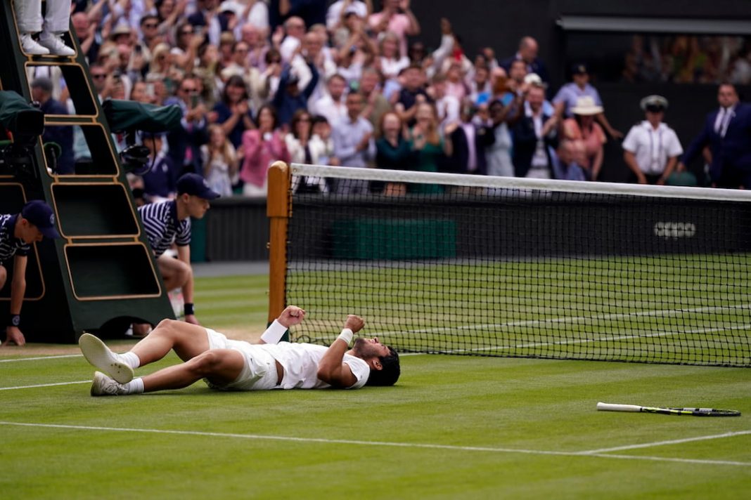 Carlos Alcaraz celebrates after beating Novak Djokovic in the men's singles final at Wimbledon. (AP PHOTO)