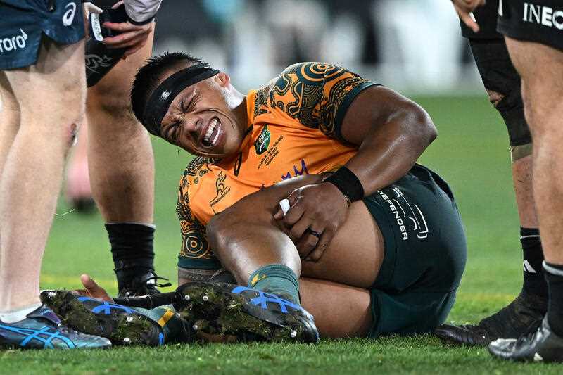 Allan Alaalatoa of Australia reacts after sustaining an injury during the 2023 Bledisloe Cup rugby match between the Australian Wallabies and the New Zealand All Blacks at the Melbourne Cricket Ground in Melbourne, Saturday, July 29, 2023