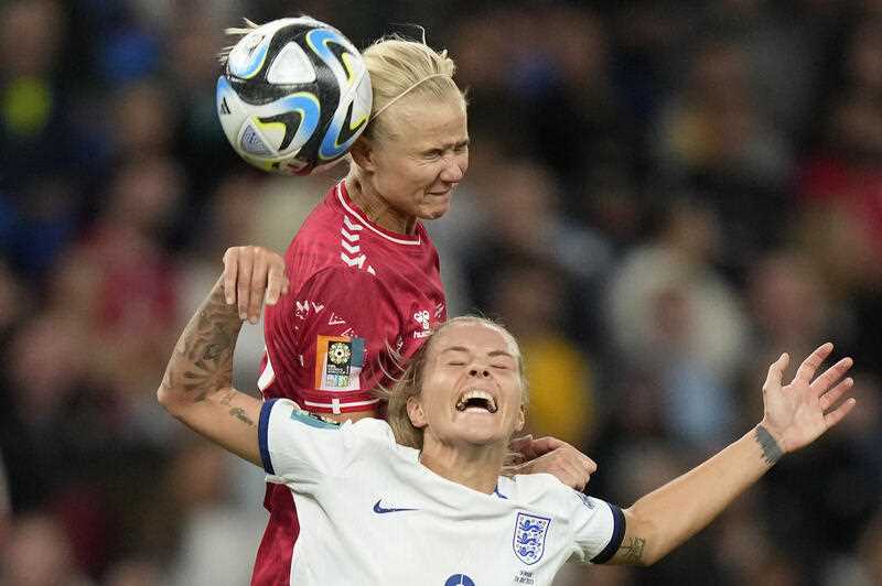 Denmark's Pernille Harder gets above England's Rachel Daly to win a header during the Women's World Cup Group D soccer match between England and Denmark at the Sydney Football Stadium in Sydney, Australia, Friday, July 28, 2023