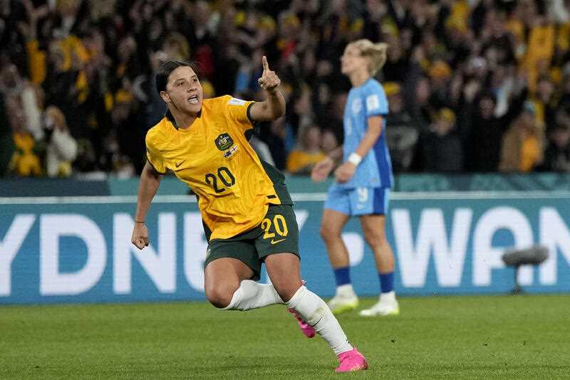 Australia's Sam Kerr celebrates after scoring her side's first goal during the Women's World Cup semifinal soccer match between Australia and England at Stadium Australia in Sydney, Australia, Wednesday, Aug. 16, 2023