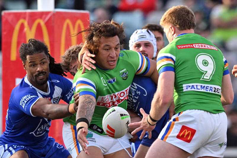 Josh Papali’i of the Raiders offloads during the NRL Round 25 match between the Canberra Raiders and the Canterbury-Bankstown Bulldogs at GIO Stadium in Canberra, Sunday, August 20, 2023