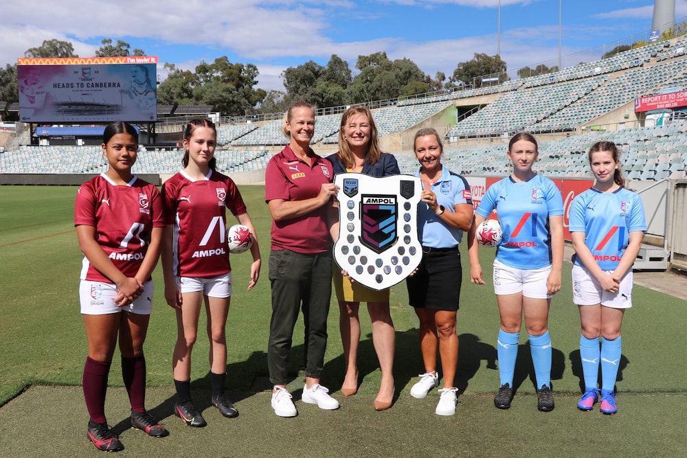 Yvette Berry, ACT Minister for Sport and Recreation, with some of Canberra's young female rugby league stars. File photo, 2022