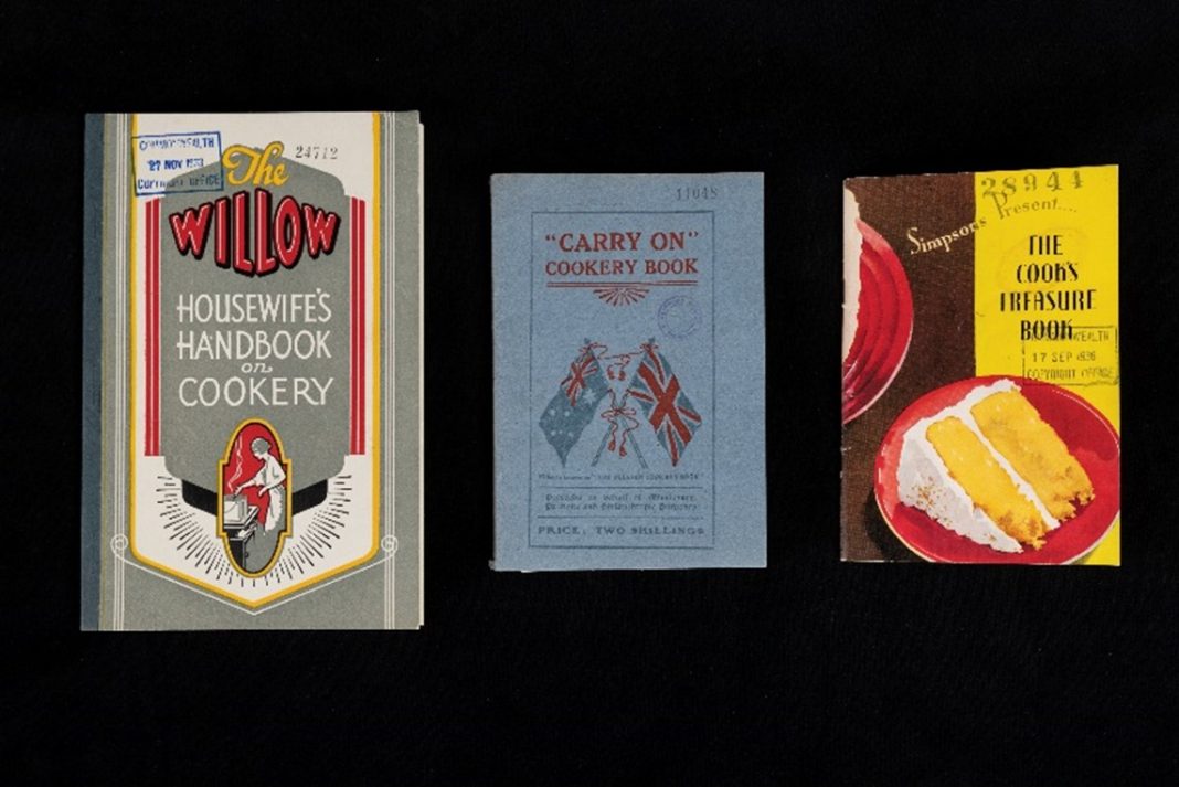 3 vintage cookbooks on black background