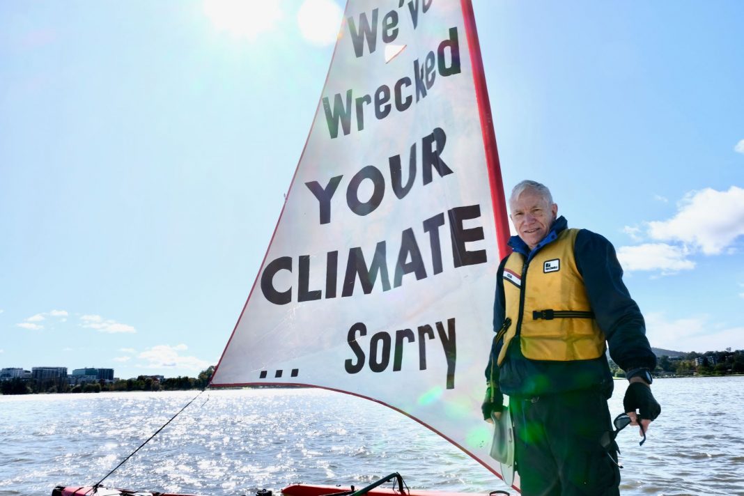 69-year-old male climate protestor sailing on Lake Burley Griffin in Canberra