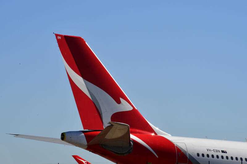 A QANTAS plane sits on the tarmac at Sydney Airport