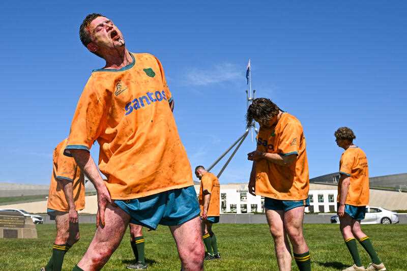 Performers stage as zombie rugby players during a protest against the Australian Wallabies rugby union team’s sponsorship from gas company Santos outside Parliament House in Canberra, Wednesday, September 13, 2023