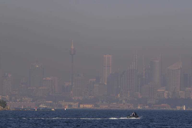 A thick a blanket of smoke hangs over parts of the Sydney following New South Wales Rural Fire Service (RFS) hazard reduction burns