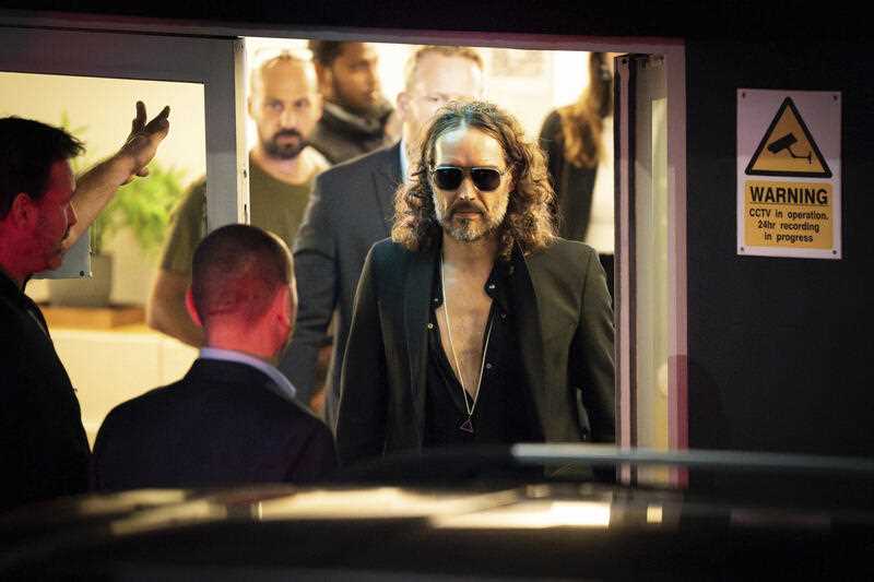 Russell Brand leaves the Troubabour Wembley Park theater in northwest London after performing a comedy set on Saturday, Sept. 16, 2023