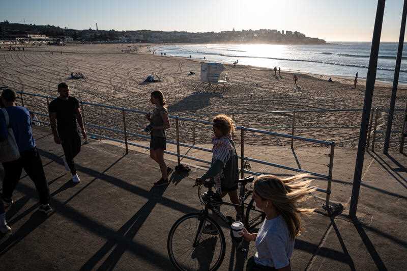 Beachgoers are seen at Bondi Beach during sunrise in Sydney, Monday, September 18, 2023.