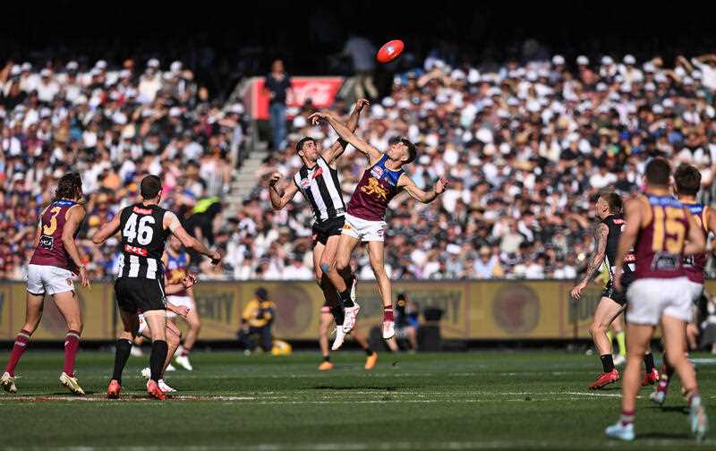 Scott Pendlebury of the Magpies contests with Josh Dunkley of the Lions during the AFL Grand Final between the Collingwood Magpies and Brisbane Lions at the Melbourne Cricket Ground in Melbourne, Saturday, September 30, 2023