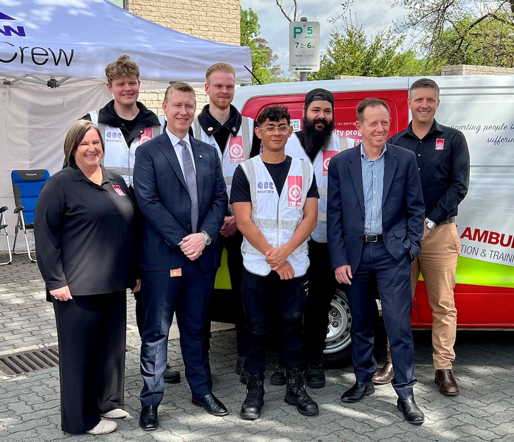 Attorney-General Shane Rattenbury MLA and St John Ambulance ACT CEO Adrian Watts with members of the CBR NightCrew. Photo: ACT Government
