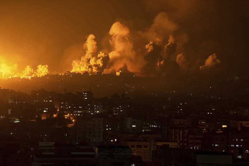 Fire and smoke rise following an Israeli airstrike, in Gaza City, Sunday, Oct. 8, 2023