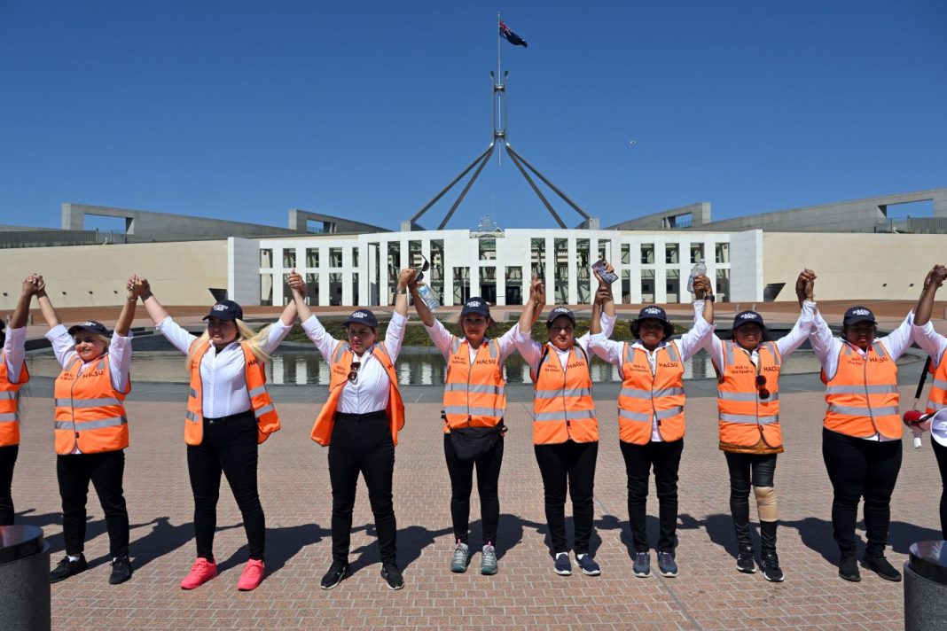 Women who walked from Melbourne to Canberra arrive during a rally for refugee rights outside Parliament House in Canberra, Wednesday, October 18, 2023.