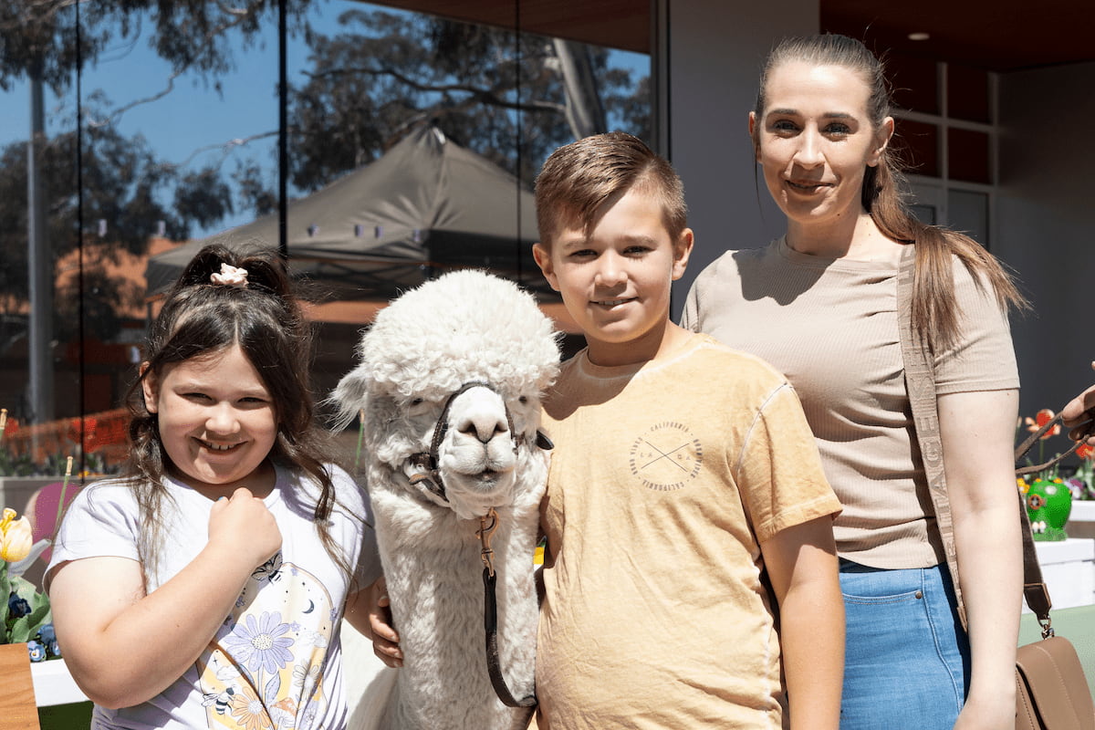 Lacey, Cooper and Kayla with Hephner the Alpaca