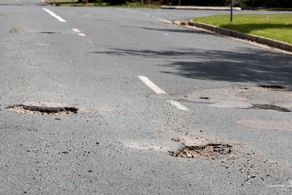 Potholes in a Canberra street. File photo: Kerrie Brewer