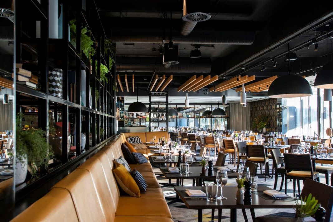 spacious interior of stylish steak restaurant, Capitol Bar & Grill at QT Canberra