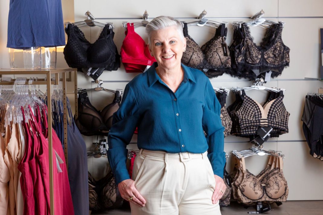 smiling woman in bra shop