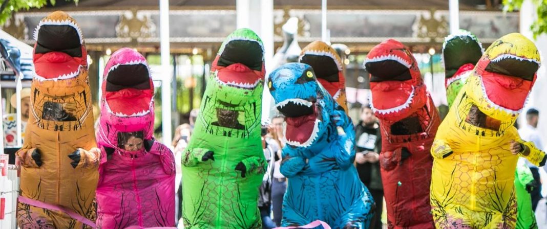 Race for glory in a giant inflatable T-Rex costume down Petrie Plaza in the City. Picture: Little Oak Sanctuary