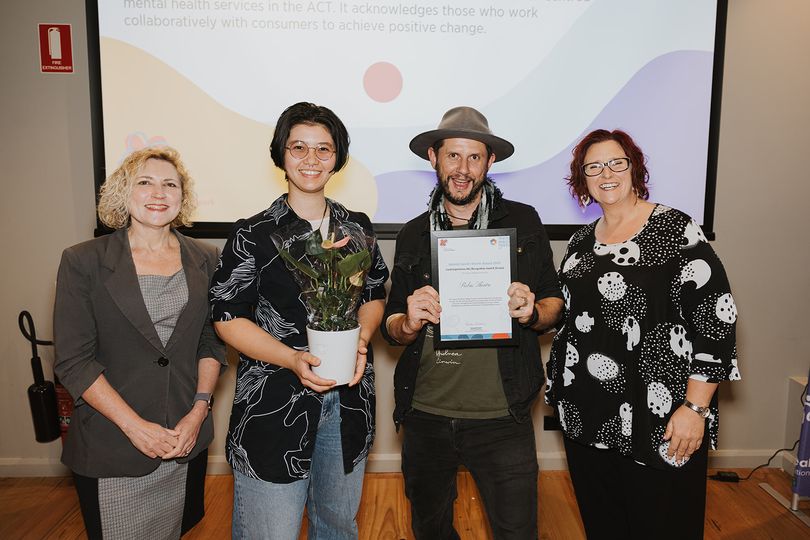 Emma Davidson, ACT Minister for Mental Health, with Rebus Theatre, recipients of the Lived Experience Ally Recognition Award. Photo supplied