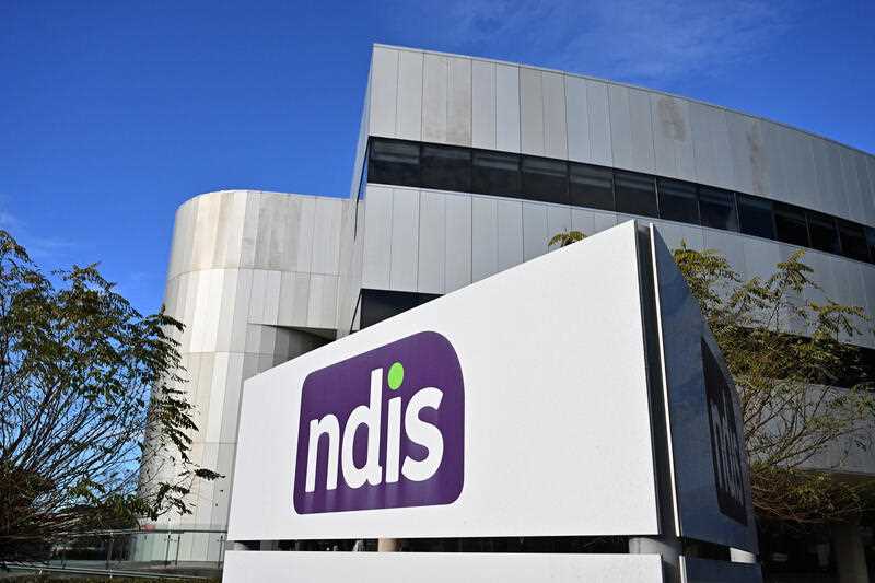 The National Disability Insurance Scheme NDIS logo is seen at the head office in Canberra