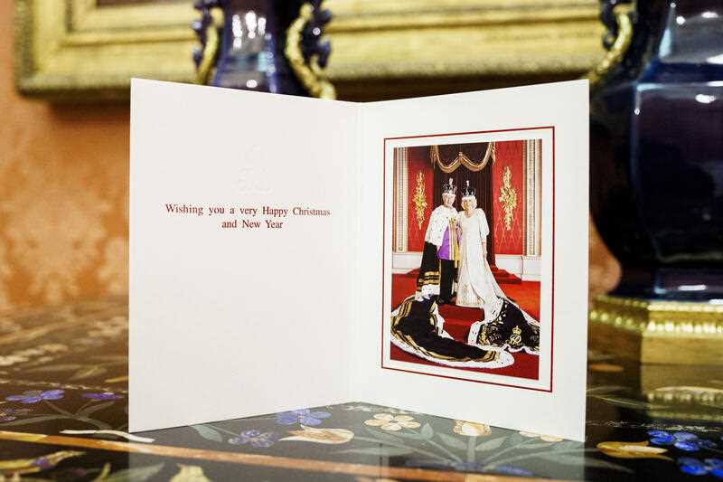 the 2023 Christmas card of Britain's King Charles III and the Queen Camilla features a photograph of the couple taken in the Throne Room at Buckingham Palace following the Coronation