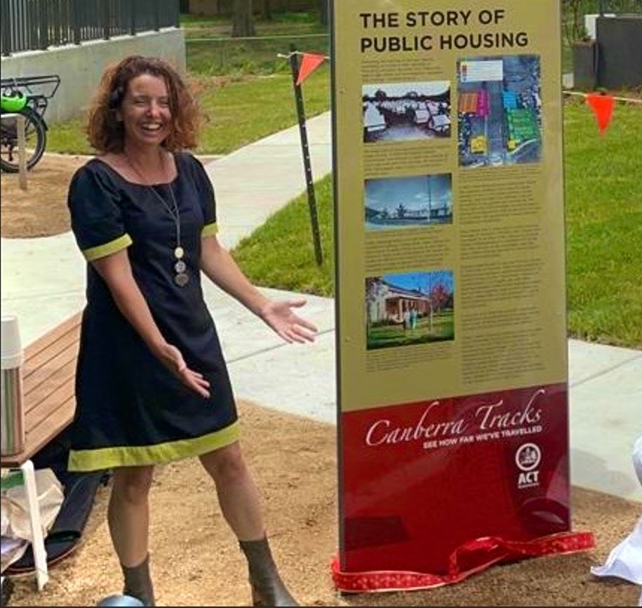 Rebecca Vassarotti, ACT Minister for Heritage, presents the new Canberra Tracks sign for the Northbourne Housing Precinct Representative Sample. Photo supplied