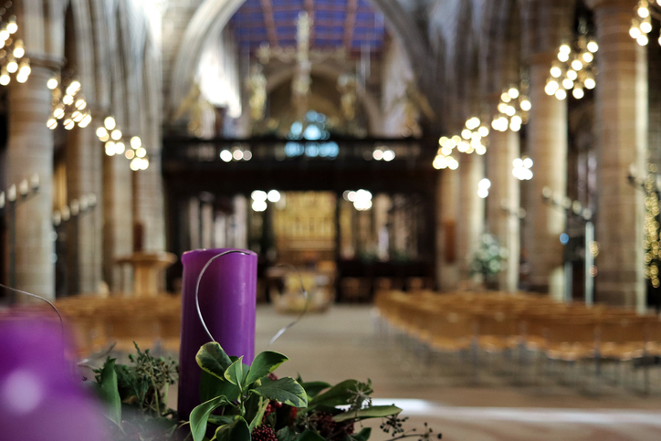 Christian cathedral decorated with candles and flowers for Christmas