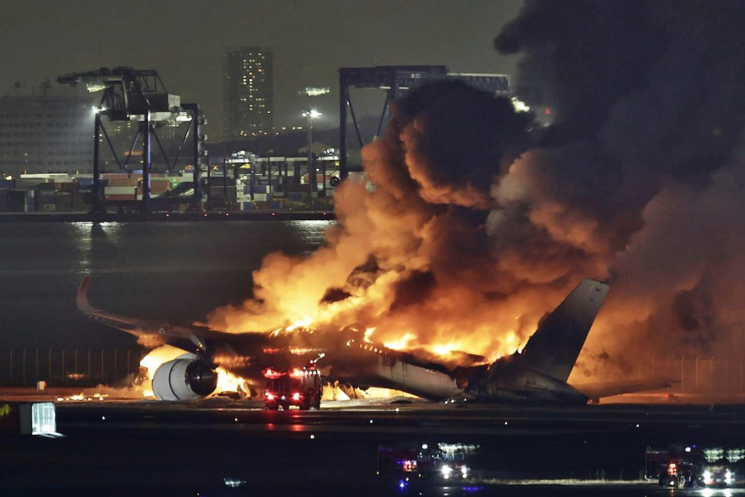 Japan plane passengers escape blaze after collision