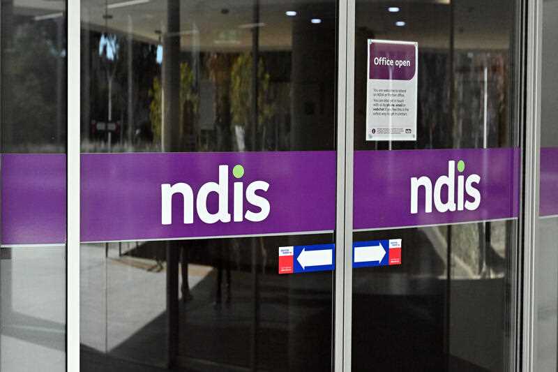 The National Disability Insurance Scheme NDIS logo is seen at the head office in Canberra