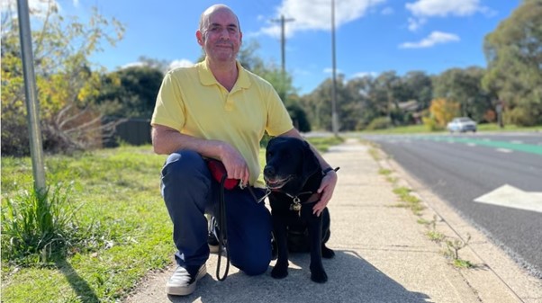 John Barlow, a blind man living in Cook, and his guide dog find it increasingly difficult to cross the suburb's busy roads. Photo supplied