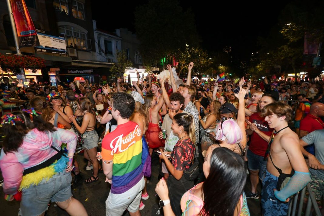 People take to the streets following the 45th annual Gay and Lesbian Mardi Gras parade on Oxford Street in Sydney, Saturday, February 25, 2023