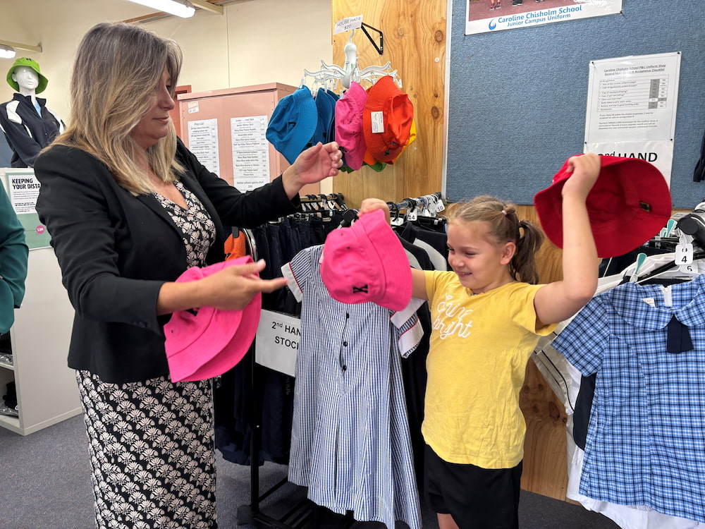 ACT education minister Yvette Berry with Isla, 8, in the Caroline Chisholm School uniform shop. Photo supplied