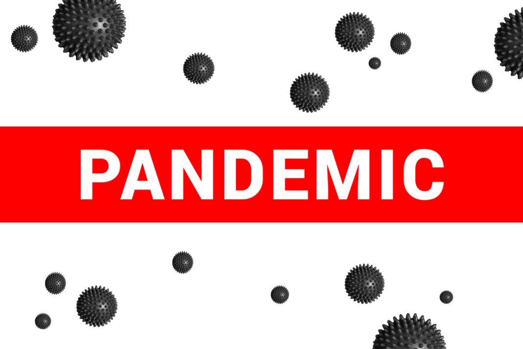 Bright red headline with inscription PANDEMIC on white with abstract Covid-19 virus strain model. Coronavirus confirmed as pandemic by World Health Organization