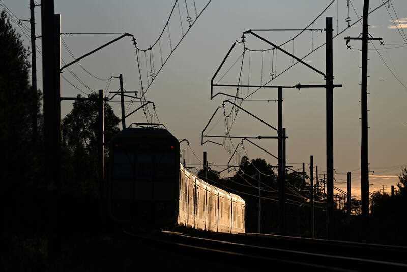 A commuter train seen in morning light in Sydney