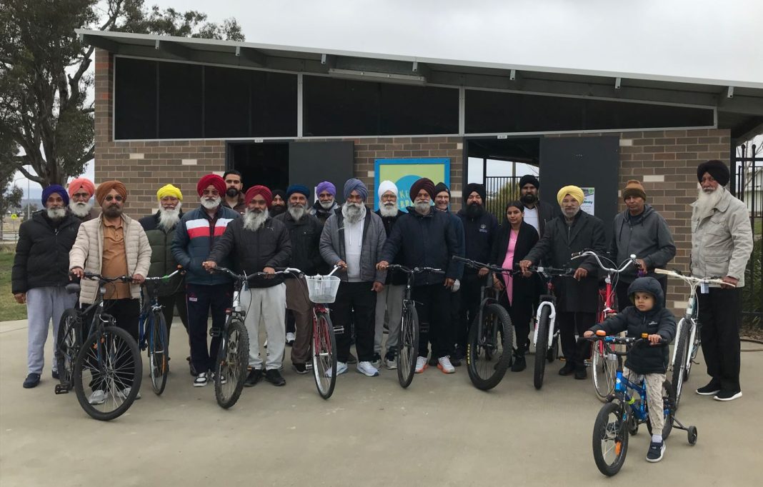 Jagmeet Sandhu and other volunteers at the Bike Library. Photo: Nicholas Fuller