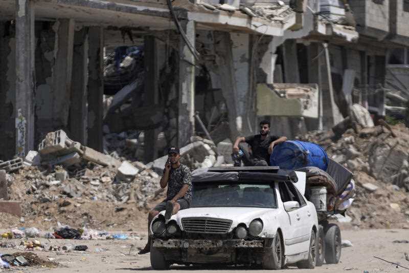 Palestinians evacuate Maghazi refugee camp in the central Gaza Strip, as part of a mass evacuation ordered by the Israeli military ahead of an operation, Saturday, Aug. 17, 2024