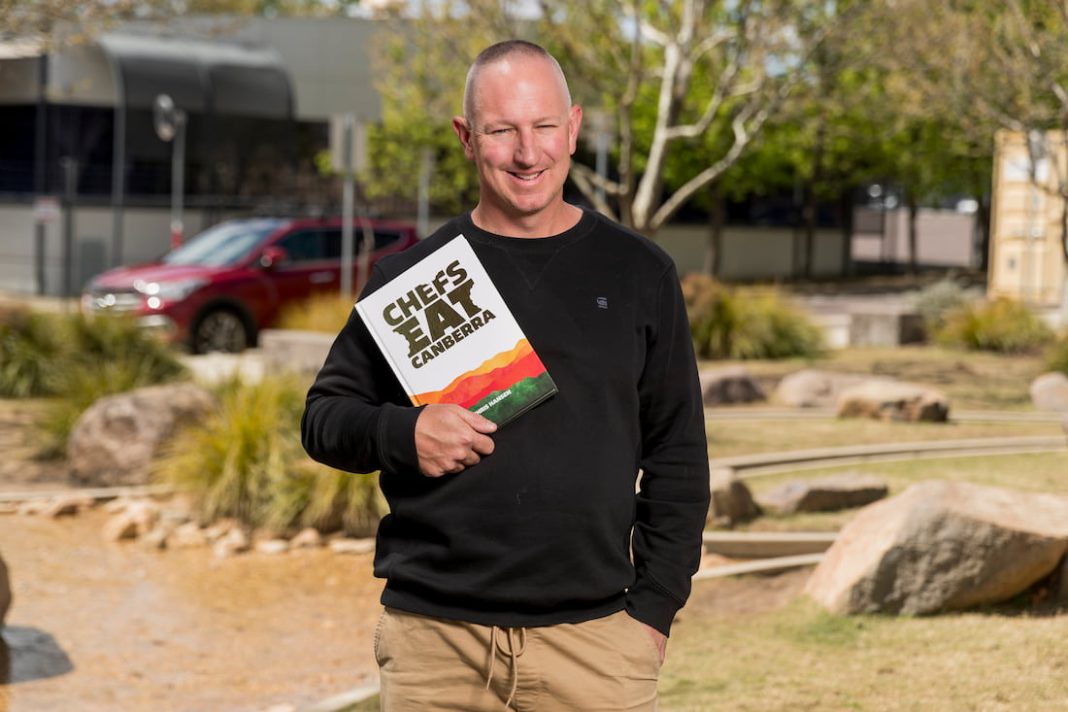 Retired restaurateur Chris Hansen with his new book Chefs Eat Canberra. Picture Jordan Mirchevski