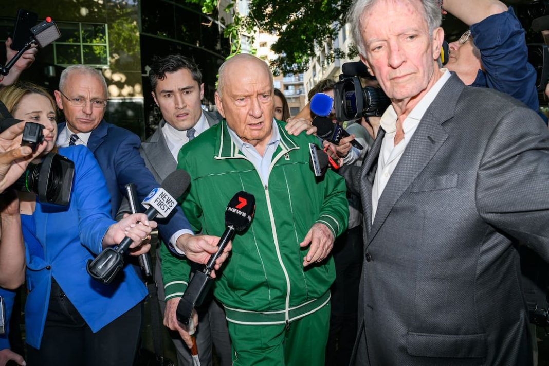 Alan Jones was silent when he left a police station on Monday after being charged with 24 offences. (Bianca De Marchi/AAP PHOTOS)